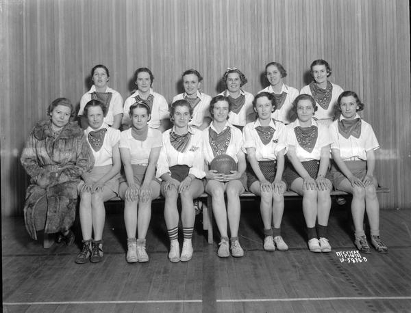 Group portrait of 13 women players and a coach, Lincoln School volleyball team.