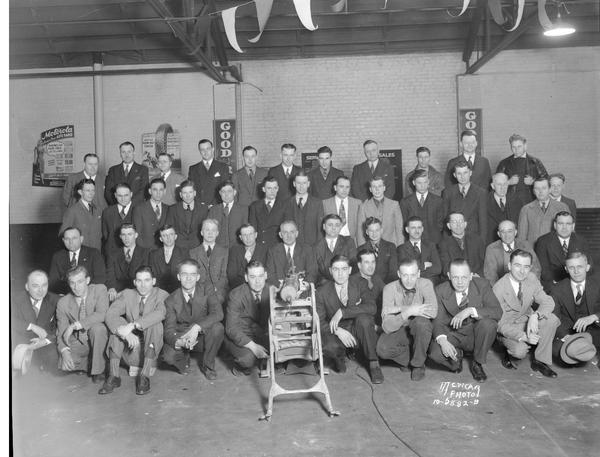 Group portrait of Goodrich tire salesmen, at a Goodrich Service Station.