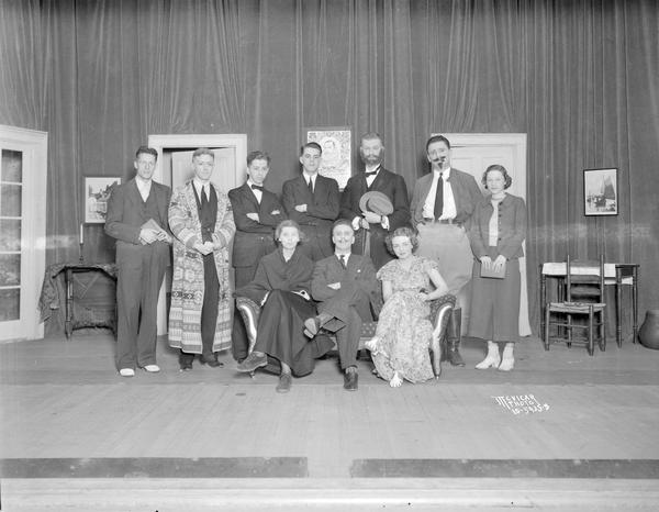 Group portrait of University of Wisconsin-Madison Spanish Department cast of "La Careta Verde" on stage in Bascom Hall.