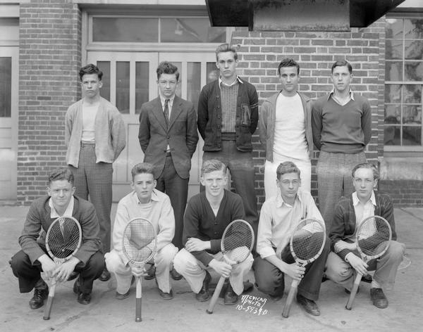 Group portrait of the Central High School boys tennis team.