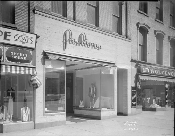 Fashions Women's Wear, 24 E. Mifflin Street, storefront, taken for architect Frank Riley who had his office in the building. Also shows Betty Shoppe, 22 E. Mifflin Street, Woldenberg's Inc., 26 E. Mifflin Street.