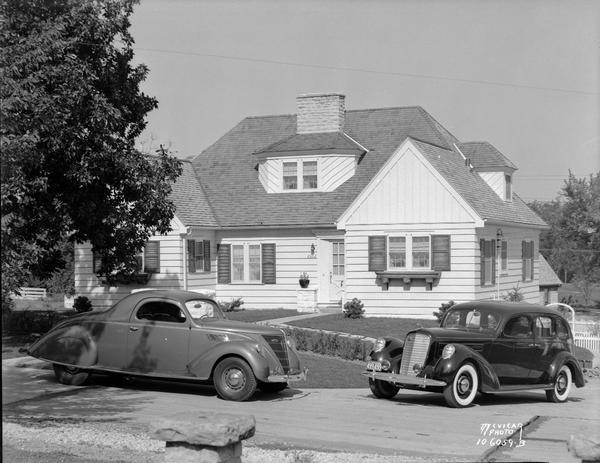 Lincoln and Zephyr automobiles parked in front of John and Margaret Moore home, 3502 Blackhawk Drive, Shorewood Hills, for Kayser Motors.