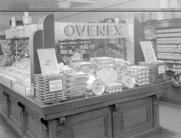 Counter display of Ovenex baking tinware in Woolworth's. 1 E. Main Street.