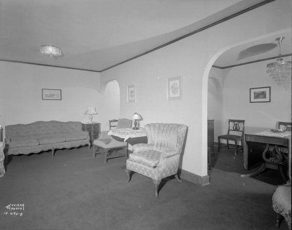 Mrs. Kate (widow of Leonard) Gay's living room, looking south into the dining room, in her apartment 101, Lyon Apartments, 330 N. Carroll Street.