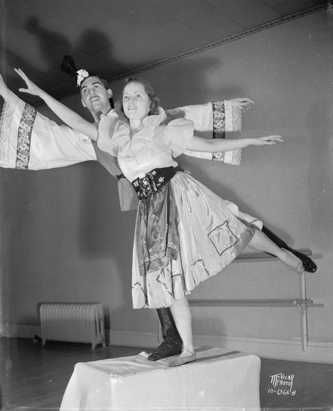 Portrait of a male and a female dancer in folk costume, striking a pose. Taken for Hazel Conlon School of Dance.