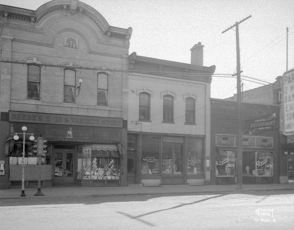 Fort Atkinson street corner, showing Beebe's 5-10 & Variety Store, Mueller Co. Hatchery and Crystal Restaurant.