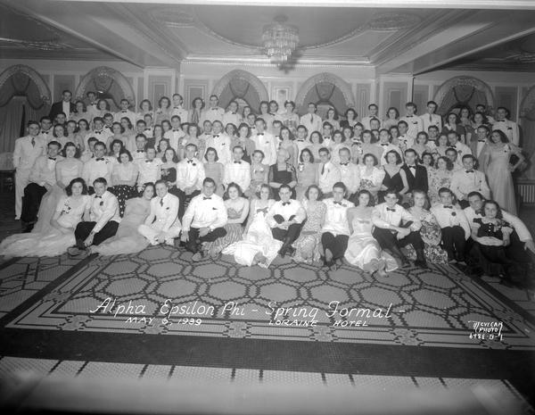 Group portrait of the Alpha Epsilon Phi spring formal taken in the Pompeiian Room at the Loraine Hotel.
