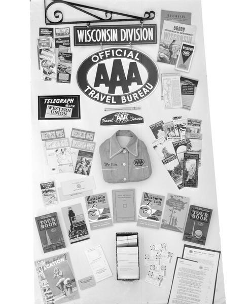 Display of travel materials for Wisconsin Division of AAA American Automobile Association Travel Bureau.