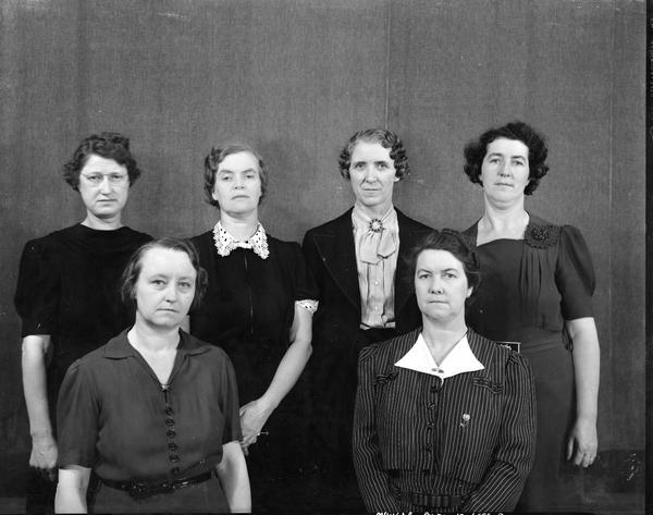 Close-up group portrait of six women teachers at East Side High School, 2222 East Washington Avenue.