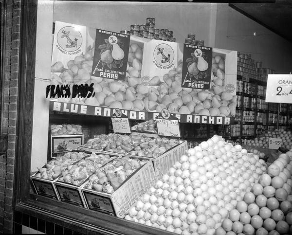 Display of pears from Blue Anchor California Fruit Exchange in window of Frank Brothers, Inc., 609-613 University Avenue.