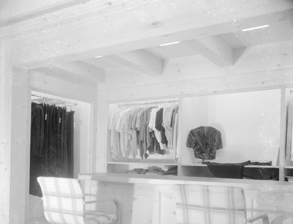 Manchester's, Inc., Department Store, 2-6 East Mifflin Street, blouse department on remodeled second floor. In the alcove are two chairs are in front of a counter, with clothing on racks on display.