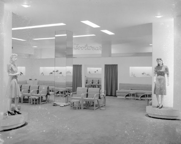 Manchester's, Inc., Department Store, 2-6 East Mifflin Street. There are two mannequins wearing dresses and shoes at the entrance to Footwear Department, with shoe displays and chairs on remodeled second floor.