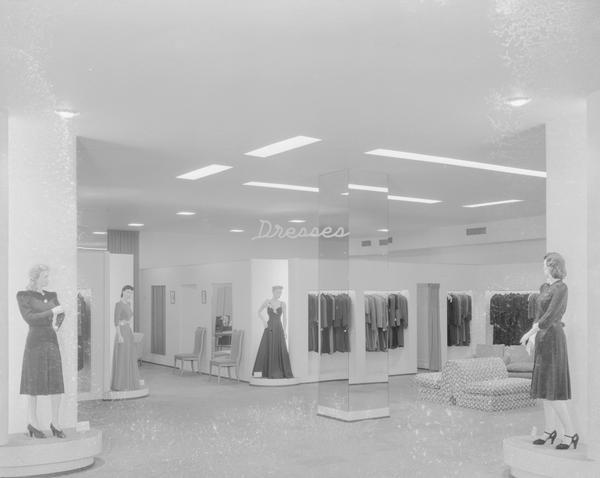 Manchesters Department Store, 2-6 East Mifflin Street. Two mannequins are wearing short dresses, and two mannequins are wearing floor length dresses in the dress department, remodeled second floor.