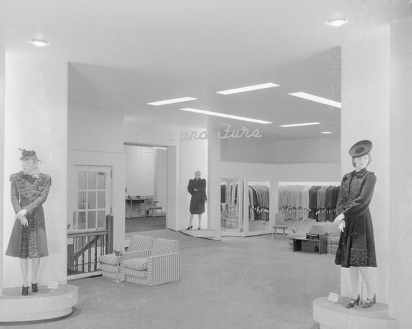 Three mannequins wearing coats in Manchesters Department Store, 2-6 East Mifflin St., coats and furs department, remodeled second floor.