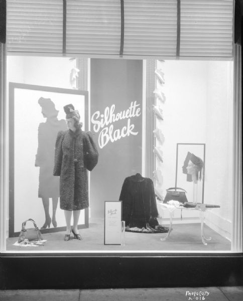 Manchester's, Inc., Department Store, 2-6 E. Mifflin Street, "Silouette Black" window display, with mannequin in a fur coat, hat, and other items of outdoor wear.