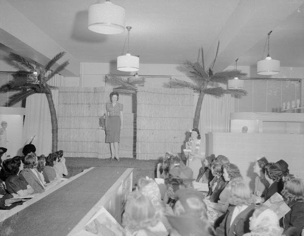 Women's style show (for McCall's) at Manchesters Department Store, 2-6 East Mifflin Street, showing female model and announcer.
