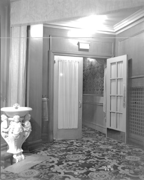 Lobby interior of Orpheum Theatre, 216 State Street, showing the entrance to Aisle 1, and an ornate drinking fountain on the left.