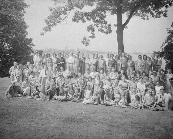 Group portrait of Lange family at a reunion in Olin Park, with the Madison skyline in the background.