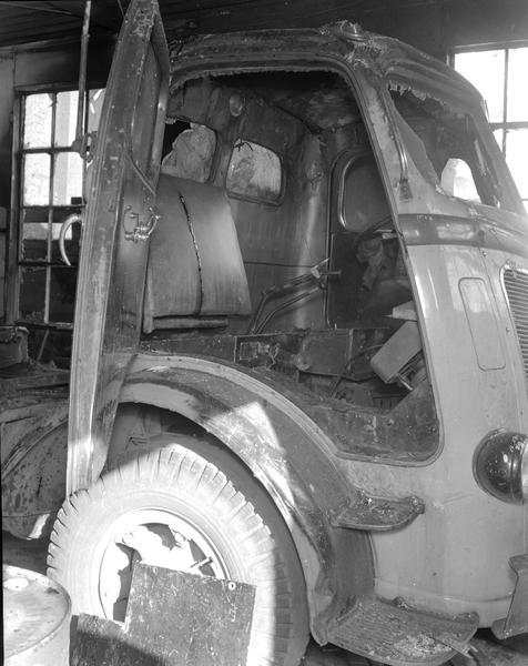 Close-up view of the burned out cab af a Gateway truck in a repair shop.