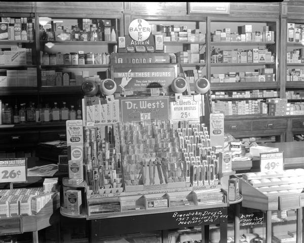 Counter display of Dr. West's Miracle Tuft toothbrushes at Rennebohm Drug Store #1, 1357 University Avenue at the corner of Randall Avenue.