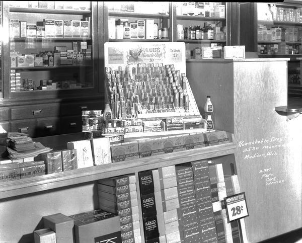 Counter display of Dr. West's Miracle Tuft toothbrushes at Rennebohm's drug store, 2526 Monroe Street.