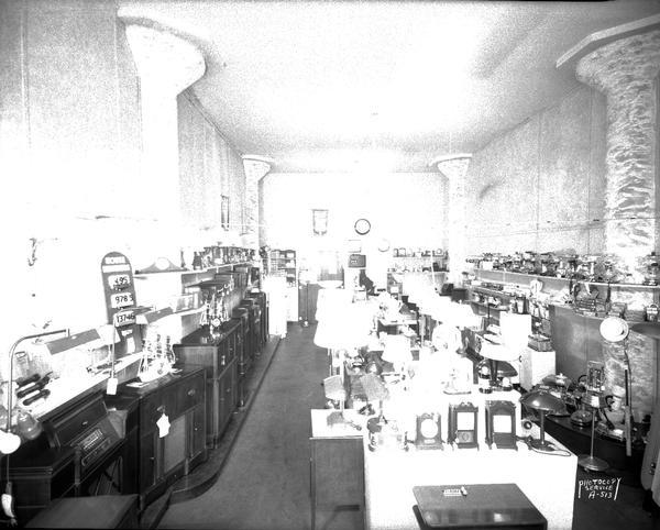 Interior view of Co-op Electric Store, 155 East Wilson Street, showing small electric household appliances.