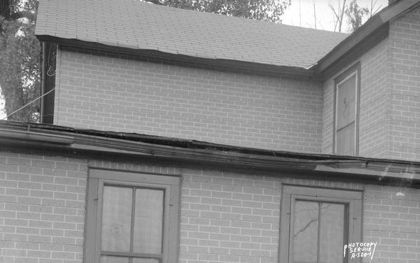 Dobby's Cosmo Club, owned by John C. Dobson, Route 1, Mendota, rear exterior view of damaged roof and gutter.