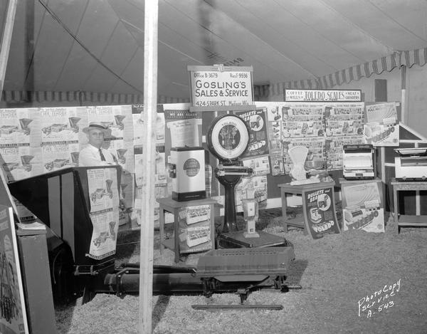 Gosling's Sales and Service display at West Side Business Men's Association harvest festival featuring coffee grinders, meat grinders and Holcomb & Hoke Manufacturing Company Fire Tender.