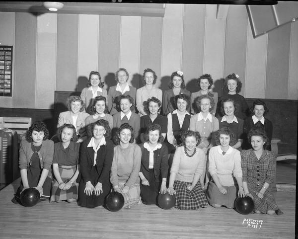 Group portrait of First National Bank women's bowling teams at Schwoegler's Bowling Alley, 437 West Gilman Street.
