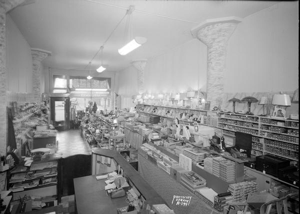 Interior of Wisconsin Electric Cooperative Store, in Wisconsin Union Transfer Building, 155-303 West Wilson Street, showing toys, Christmas decorations and lamps.