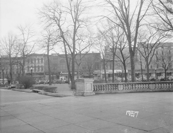 First block of East Main Street taken from Capitol grounds showing, left to right: Kresge Building, Klauber & Hobbins Building, Feltman & Curme Shoes, J.C. Penney Department Store, Rundell's Men Furnishings, Uphoff's Restaurant, Cannon Shoe Company, The Darling Shop Women's Furnishings, and F.W. Woolworth Company.