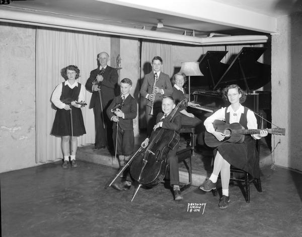 Melvin and Naomi Schneider and their five children with musical instruments. Photograph was taken for the Wisconsin School of Music.