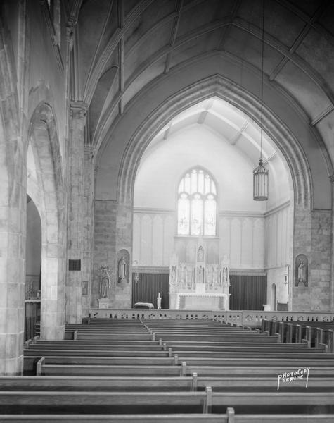 Interior view of the sanctuary of St. Bernard's Catholic Church, 2450 Atwood Avenue, from left rear, showing the altar and arch.
