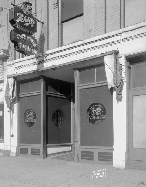 Club Royal Tavern, 122 East Washington Avenue, exterior view showing Schlitz Beer sign.