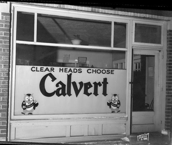 Calvert Liquor sign displayed in the window of the Plymouth Liquor Distributers, 2717 Atwood Avenue, sign reads: "Clear Heads Choose Calvert."