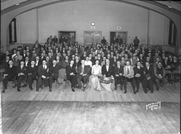 Group portrait of Automotive Trades Council members at Turner Hall, 21 South Butler Street, with Ben and Alvina Bergor, entertainers, sitting in the front row.