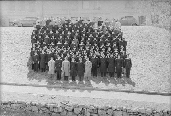 Elevated group portrait of United States Navy, Ships Company.