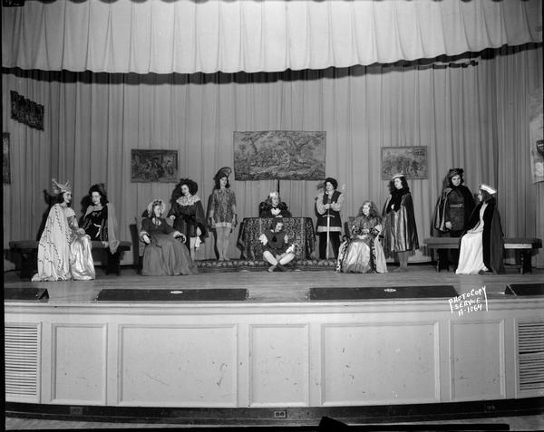 Students play cast in costume on stage at Edgewood High School, 2209 Monroe Street.