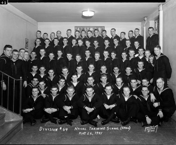 Group portrait of U.S. Naval Training School (Radio), Division #64, trainees, at University of Wisconsin-Madison.
