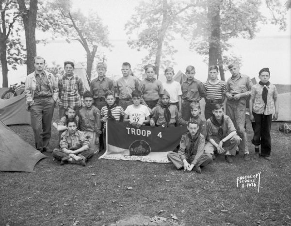 Outdoor group portrait of Boy Scouts, Troop #4 from South Side Men's Club, at Four Lakes Council Camporee in Olin Park.