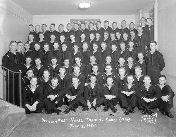 Group portrait of U.S. Naval Training School (Radio), Division #65, trainees at University of Wisconsin-Madison.