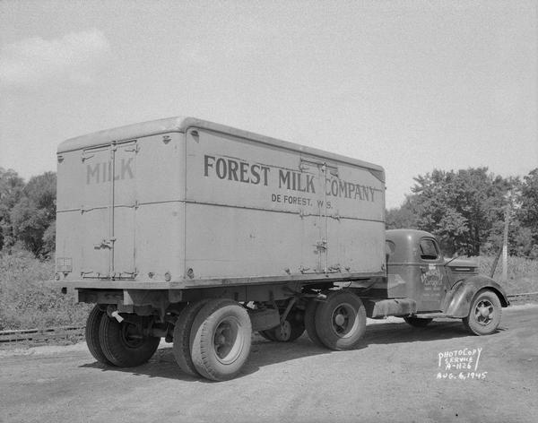 Forest Milk Company truck and trailer, showing rear and right side.