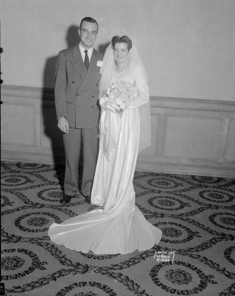 Portrait of Ann L. Longfield, bride and Joseph A. Sauer, groom.
