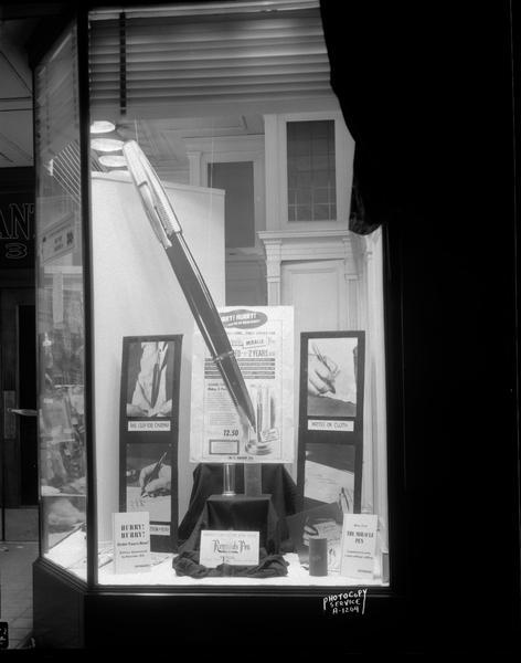 Window display of Reynolds "miracle" ballpoint pen being sold for $12.50 at W.T. Grant Co., 19-21 South Pinckney Street. Milton Reynolds became the first American manufacturer to market a ballpoint pen successfully.