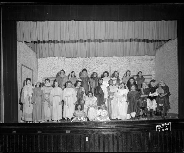 Group portrait of "Donkey and Star" play cast in Biblical costume at Holy Redeemer School, 140 West Johnson.