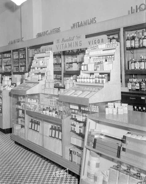 Puretest Vitamin display counter at an unidentified Rennebohm Drug Store.