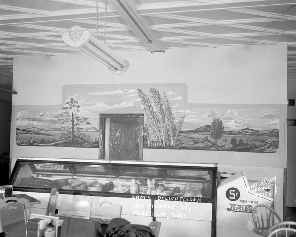 Mural of lake scene by A. Dean Swift, on the left wall of Sam's Kosher Deli, 1511 Monroe Street, showing counter with meat and delicatessen products. Owned by Samuel and Frieda Fishman.