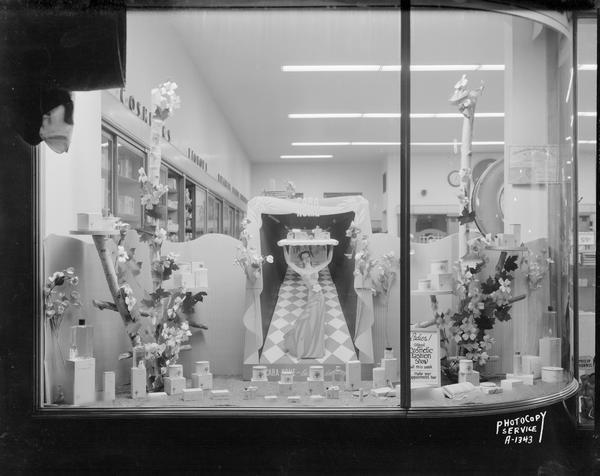 Display featuring the Cara Nome brand of cosmetics in the window of Rennebohm Drug Store #12, 2526 Monroe Street.