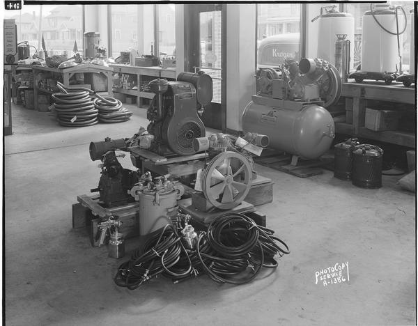 Sprayguns and compressors for painting automobiles at Winnebago Auto Replacement Company, 103 North Park Street.