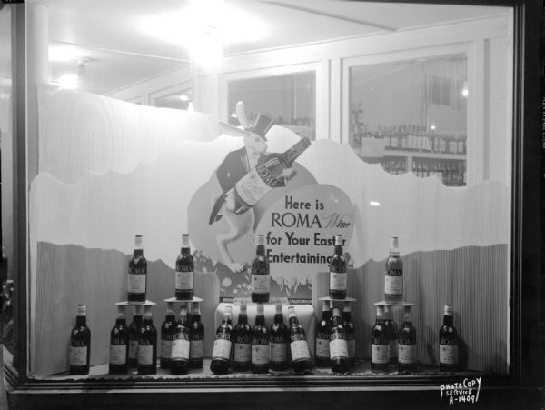 Display window at Sam's Liquor Shop, 422 North Street, featuring a rabbit holding a bottle of Roma wine "for your Easter entertainment."